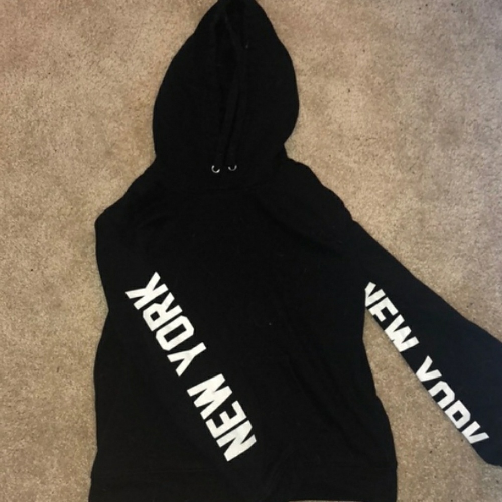 Forever 21 Black sweater. New york sleeves.